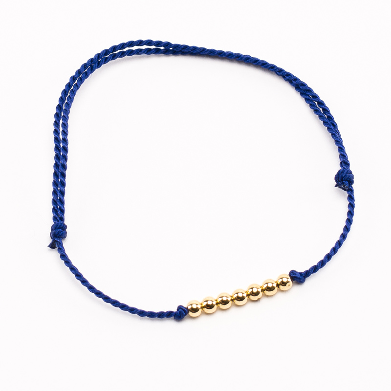 Bracelet Vibration cordon bleu foncé soie et or