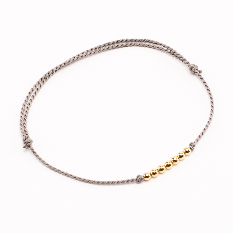 Bracelet Vibration cordon gris soie et or Bracelet Vibration cordon gris soie et or